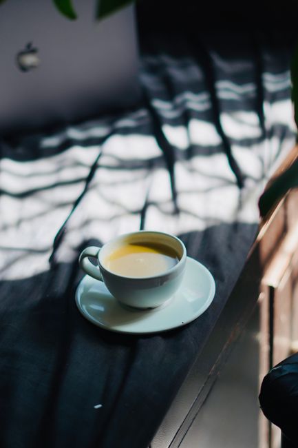 A cup of coffee in morning light, illustrating the caffeine habit that shaped my sleep.